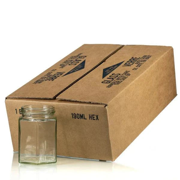 Hexagon Glass Jar with Gold Lid, 190 ml capacity, next to packaging box.