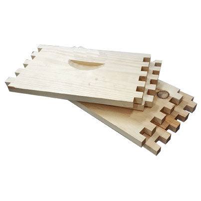 Unassembled commercial-grade bee box panels made from Canadian Pine with finger joints and handhold.