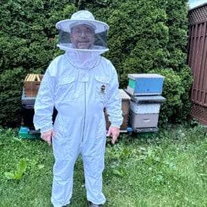 Beekeeping suit providing sting-free protection with built-in veil and adjustable cuffs.