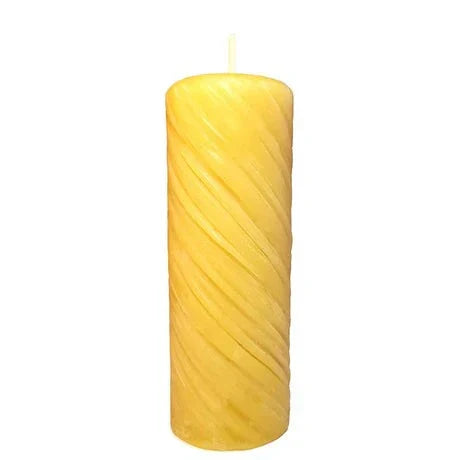 Decorative swirl pillar beeswax candle with natural golden hue and elegant design.