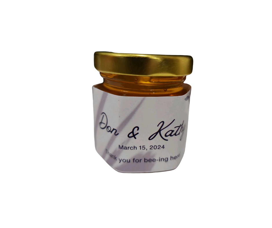 Honey favor jar with custom label for weddings and special occasions.