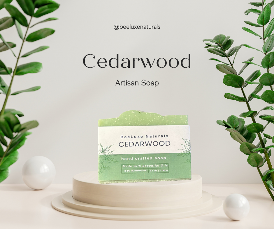 Cedarwood hand crafted soap with essential oils on a display stand, surrounded by green leaves.