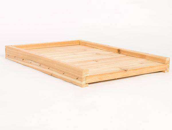 Commercial-grade white Canadian pine bottom board for beekeeping.