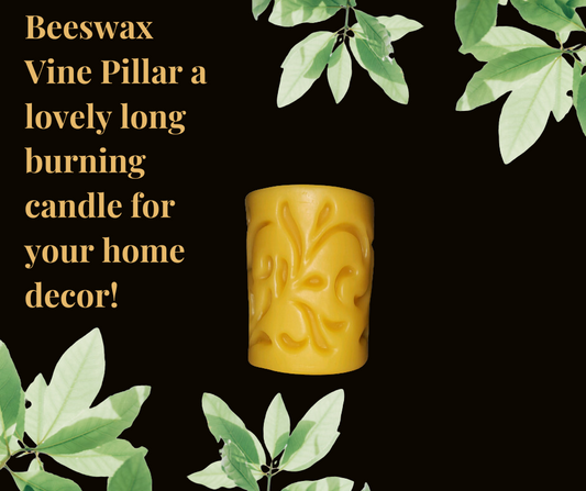 Beeswax vine pillar candle with intricate design and natural golden hue.