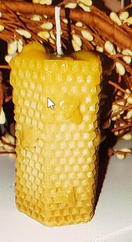 Small pillar beeswax candle with honeycomb design and bees, 2x3 inch.