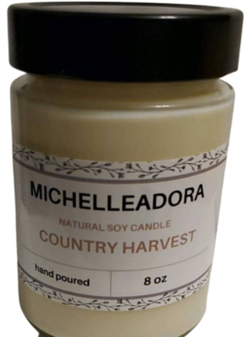 Country Harvest Soy Candle in glass jar with black metal lid, 10 oz, warm clove, apple, cinnamon scent.